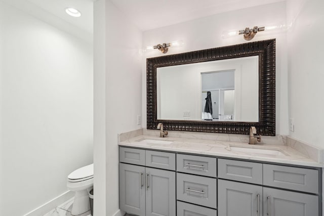 full bath featuring baseboards, toilet, double vanity, marble look tiles, and recessed lighting