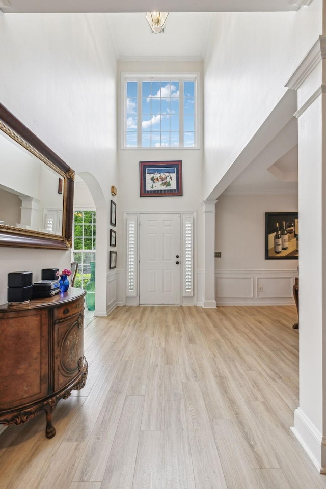 231 Green Harbor Rd Unit 44, Old Hickory, TN 37138 - entrance foyer featuring a decorative wall, wood finished floors, arched walkways, a towering ceiling, and decorative columns