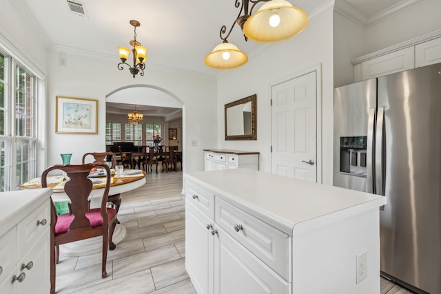 231 Green Harbor Rd Unit 44, Old Hickory, TN 37138 - kitchen featuring stainless steel fridge with ice dispenser, a chandelier, arched walkways, ornamental molding, and decorative light fixtures