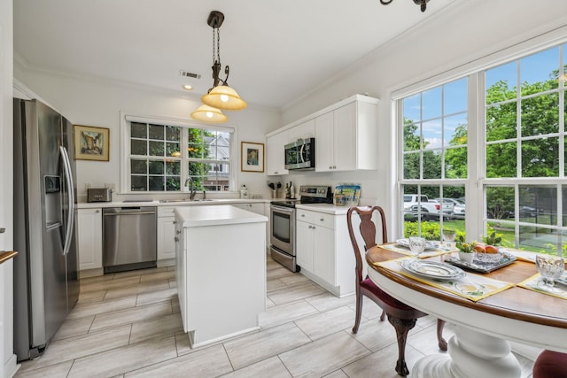 231 Green Harbor Rd Unit 44, Old Hickory, TN 37138 - kitchen with stainless steel appliances, crown molding, a sink, light countertops, and white cabinets