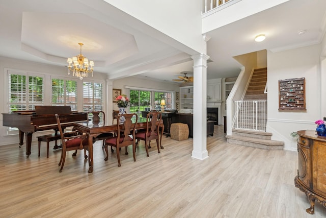 231 Green Harbor Rd Unit 44, Old Hickory, TN 37138 - dining area featuring a fireplace, stairs, light wood finished floors, a chandelier, and ornate columns