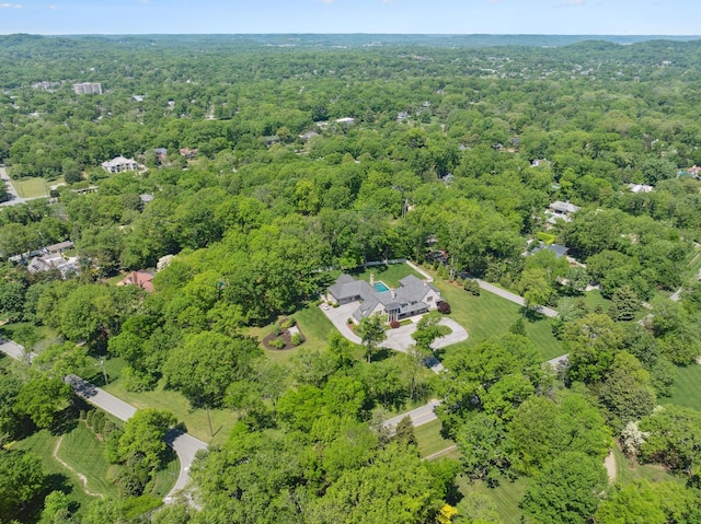 view of property location featuring a heavily wooded area