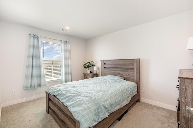 bedroom featuring carpet and baseboards