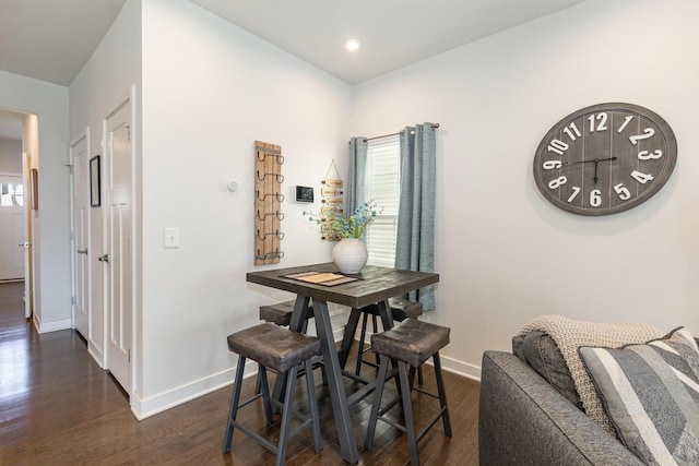 dining area featuring baseboards, dark wood-style flooring, and recessed lighting