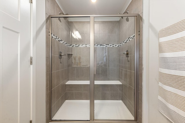 full bath with a shower stall