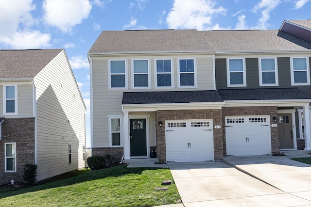 view of front of house featuring driveway, a garage, a front yard, a shingled roof, and stone siding