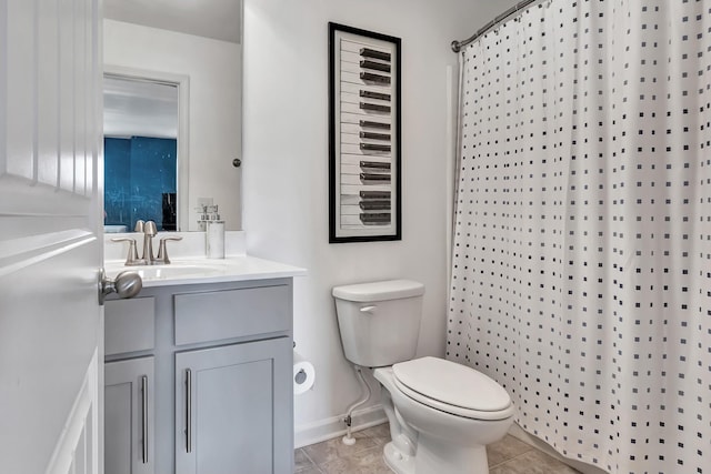 bathroom with vanity, toilet, baseboards, tile patterned flooring, and a shower with shower curtain