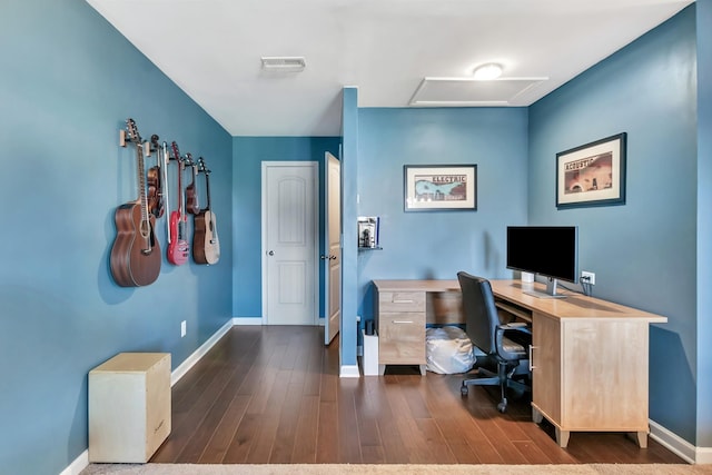 office with baseboards, wood finished floors, and attic access