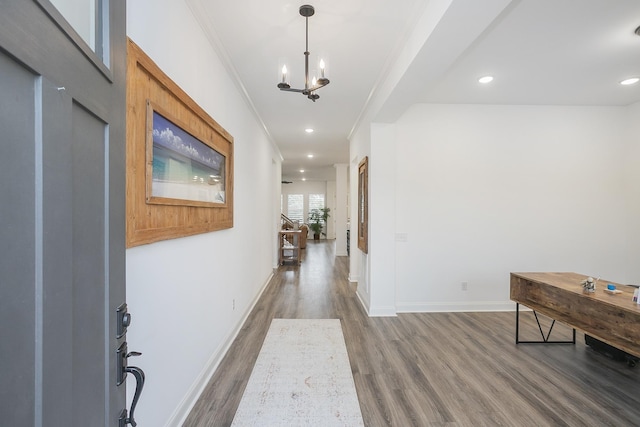 928 Tynan Way, Nolensville, TN 37135 - hallway featuring wood finished floors, crown molding, a chandelier, baseboards, and recessed lighting
