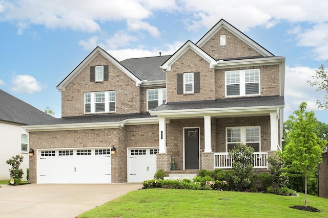 928 Tynan Way, Nolensville, TN 37135 - craftsman house featuring an attached garage, concrete driveway, a front yard, covered porch, and brick siding