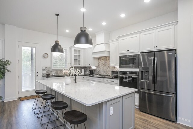 928 Tynan Way, Nolensville, TN 37135 - kitchen featuring stainless steel appliances, dark wood-style floors, decorative backsplash, and recessed lighting