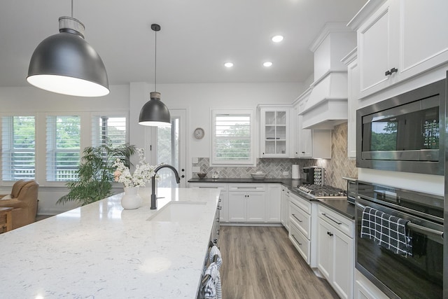 928 Tynan Way, Nolensville, TN 37135 - kitchen featuring stainless steel appliances, a sink, tasteful backsplash, healthy amount of natural light, and recessed lighting
