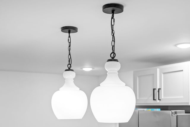 5921 Keysburg Rd, Adams, TN 37010 - kitchen view of white cabinetry and hanging light fixtures