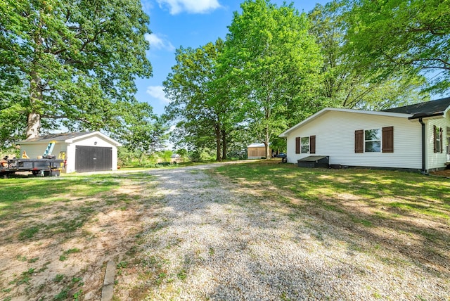5921 Keysburg Rd, Adams, TN 37010 - view of yard featuring a storage shed, an outdoor structure, and driveway