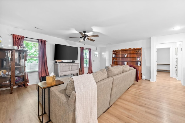 5921 Keysburg Rd, Adams, TN 37010 - living area featuring ceiling fan, light wood finished floors, healthy amount of natural light, and baseboards