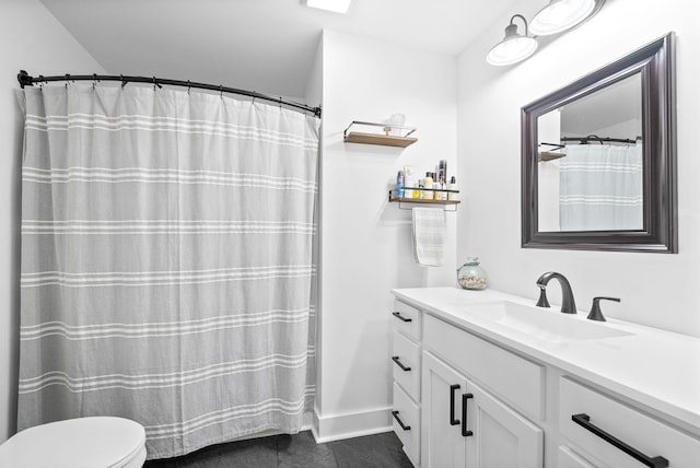 5921 Keysburg Rd, Adams, TN 37010 - bathroom featuring toilet, vanity, and tile patterned flooring