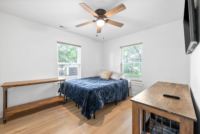 5921 Keysburg Rd, Adams, TN 37010 - bedroom with multiple windows, light wood-style flooring, and a ceiling fan