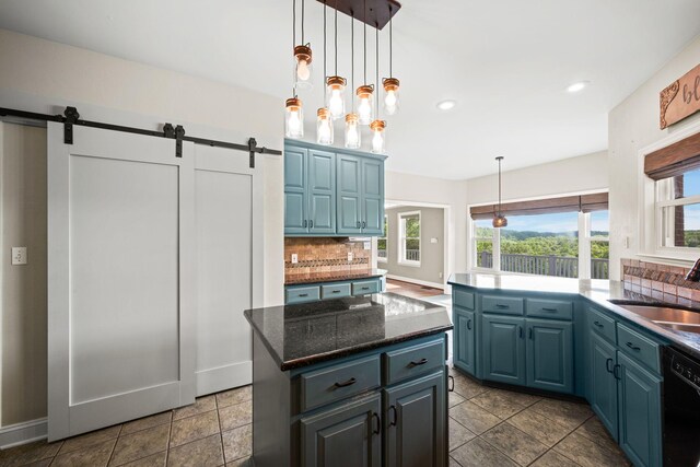 1709 Wildlife Trl, Kingston Springs, TN 37082 - kitchen featuring black dishwasher, healthy amount of natural light, decorative backsplash, a barn door, and recessed lighting