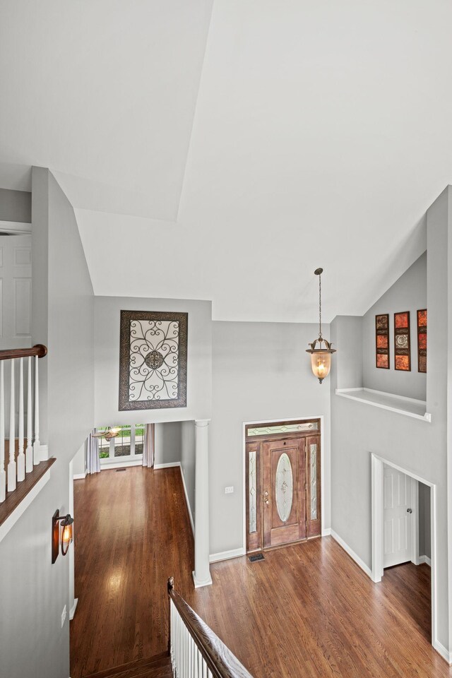1709 Wildlife Trl, Kingston Springs, TN 37082 - hall with an upstairs landing, vaulted ceiling, wood finished floors, and baseboards