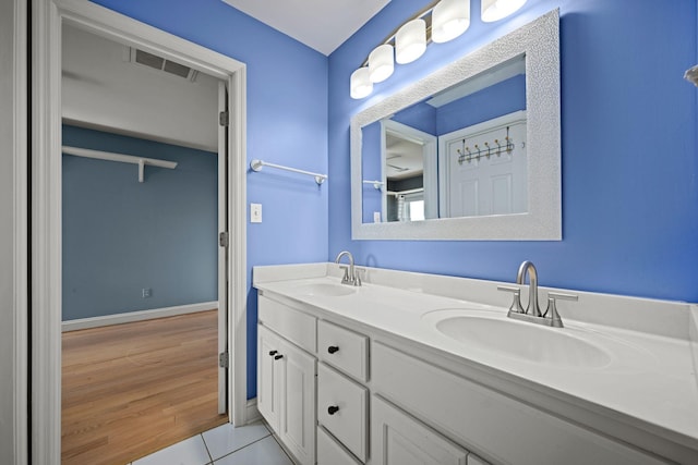 1709 Wildlife Trl, Kingston Springs, TN 37082 - bathroom featuring double vanity, tile patterned floors, and baseboards