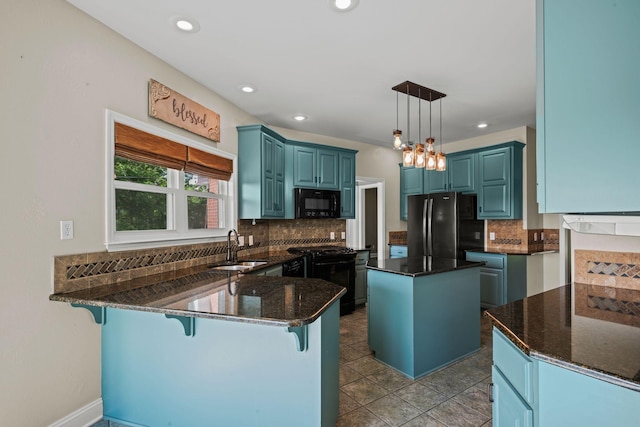 1709 Wildlife Trl, Kingston Springs, TN 37082 - kitchen with black appliances, a sink, a peninsula, decorative backsplash, and recessed lighting
