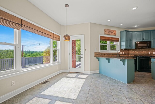 1709 Wildlife Trl, Kingston Springs, TN 37082 - kitchen featuring black appliances, dark countertops, plenty of natural light, decorative backsplash, and recessed lighting