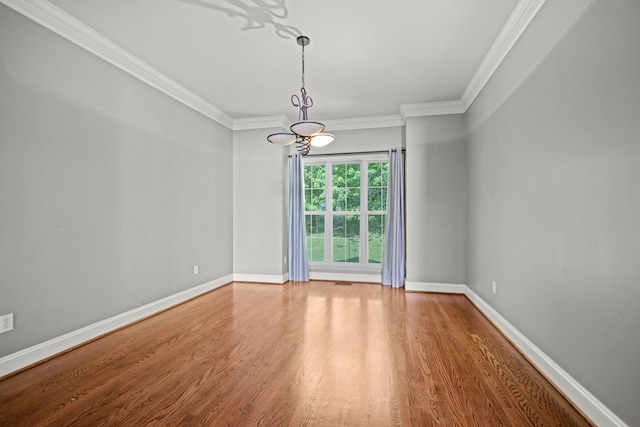 1709 Wildlife Trl, Kingston Springs, TN 37082 - spare room with wood finished floors, a chandelier, ornamental molding, and baseboards