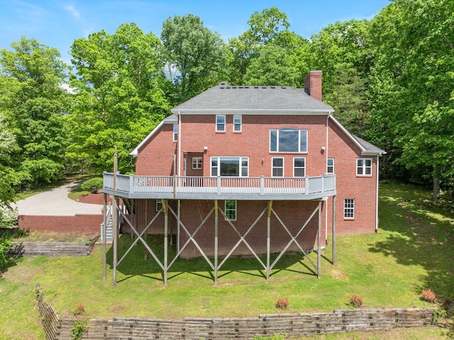 1709 Wildlife Trl, Kingston Springs, TN 37082 - rear view of house with a deck, a chimney, brick siding, a yard, and stairway