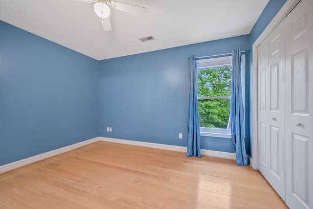 1709 Wildlife Trl, Kingston Springs, TN 37082 - unfurnished bedroom with baseboards, light wood finished floors, a closet, and a ceiling fan