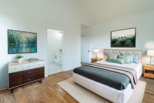 463 Waterfront Way, Ten Mile, TN 37880 - bedroom with light wood-style floors, baseboards, and connected bathroom