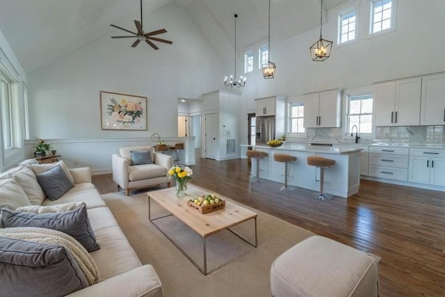 463 Waterfront Way, Ten Mile, TN 37880 - living area with high vaulted ceiling, dark wood-style floors, ceiling fan, and a chandelier