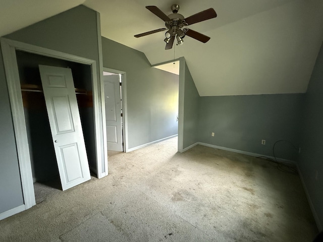bonus room with carpet flooring, vaulted ceiling, ceiling fan, and baseboards