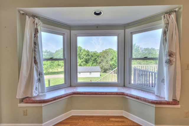 detailed view of baseboards and wood finished floors