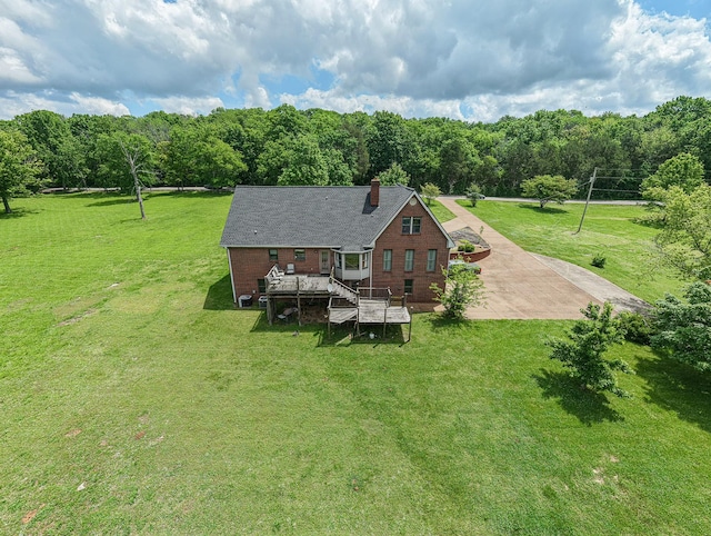 view from above of property featuring a heavily wooded area