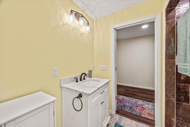 bathroom with vanity and baseboards