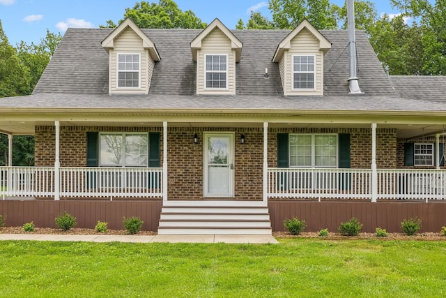 2907 York Rd, Pleasant View, TN 37146 - view of front of home featuring covered porch, brick siding, and a front yard