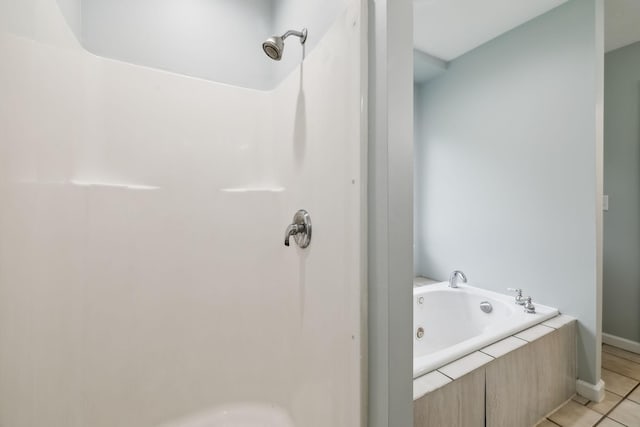 2907 York Rd, Pleasant View, TN 37146 - full bathroom featuring a tub with jets, a shower, tile patterned flooring, and baseboards