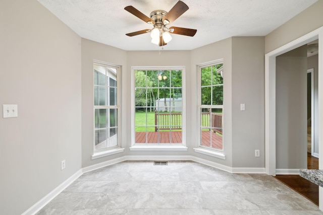 2907 York Rd, Pleasant View, TN 37146 - spare room with ceiling fan, baseboards, and a textured ceiling