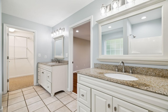 2907 York Rd, Pleasant View, TN 37146 - full bath featuring two vanities, tile patterned flooring, recessed lighting, and a spacious closet