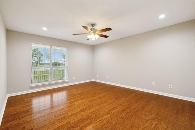 2907 York Rd, Pleasant View, TN 37146 - spare room featuring wood finished floors, baseboards, a ceiling fan, and recessed lighting
