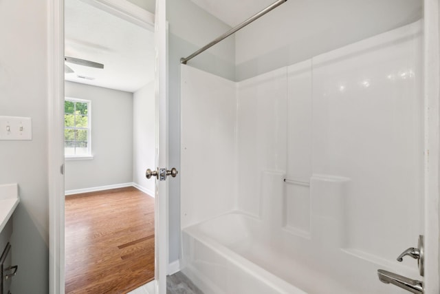 2907 York Rd, Pleasant View, TN 37146 - full bath with wood finished floors, shower / bath combination, vanity, and baseboards