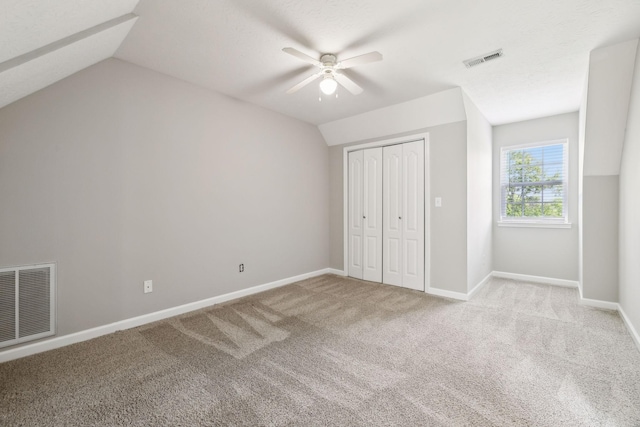 2907 York Rd, Pleasant View, TN 37146 - unfurnished bedroom featuring carpet, vaulted ceiling, baseboards, a closet, and a ceiling fan