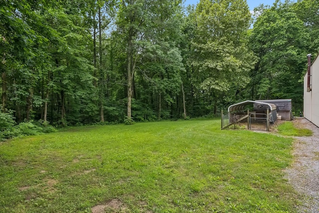 2907 York Rd, Pleasant View, TN 37146 - view of green lawn featuring a detached carport