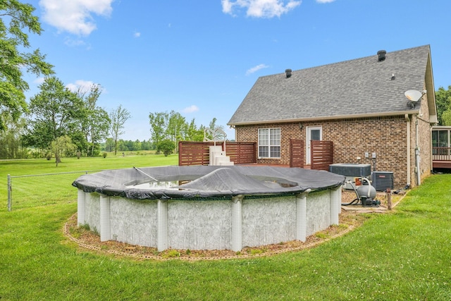 2907 York Rd, Pleasant View, TN 37146 - view of pool featuring a yard, a covered pool, central AC unit, and a wooden deck