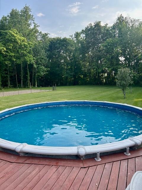 2907 York Rd, Pleasant View, TN 37146 - outdoor pool with a yard and a wooden deck