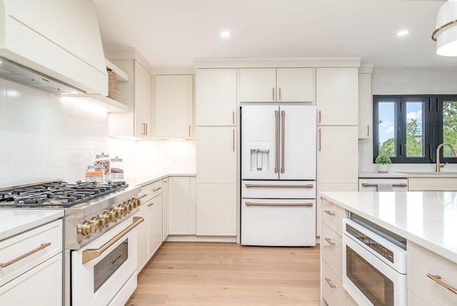 95 Short Dr, Mount Juliet, TN 37122 - kitchen with high end appliances, light countertops, decorative backsplash, a sink, and recessed lighting