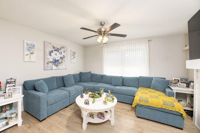 living area with ceiling fan and wood finished floors