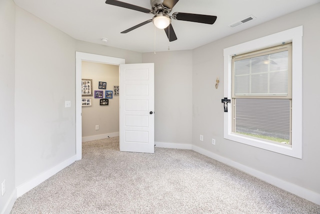 unfurnished bedroom featuring carpet floors, baseboards, and ceiling fan