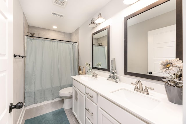 full bathroom with toilet and double vanity