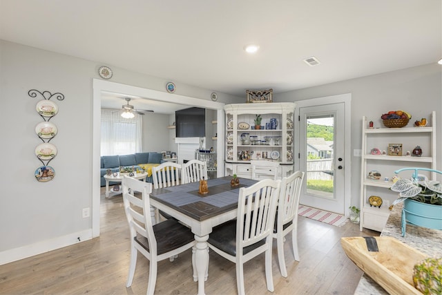 dining area featuring light wood-style floors, healthy amount of natural light, a ceiling fan, and recessed lighting